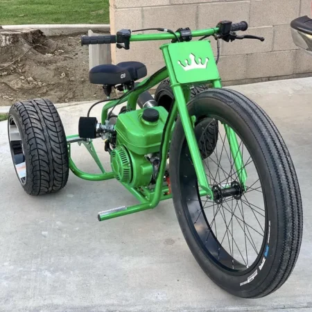 Green Big Wheeler Mini Trike showcasing its powerful engine and sleek design